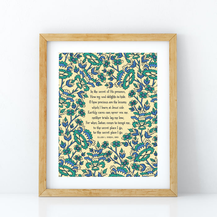 In the Secret of His Presence hymn art print, surrounded by a vibrant blue and aqua floral illustration, displayed in a light wood frame.