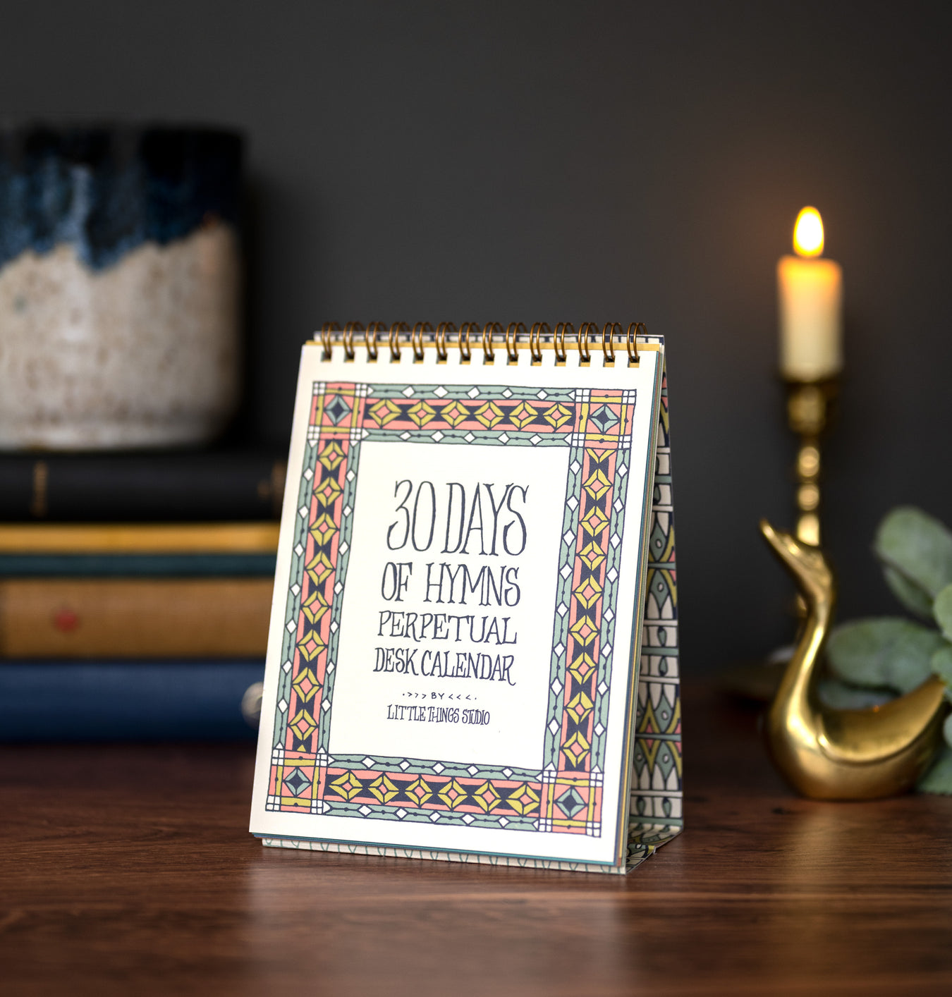 30 days of hymns perpetual calendar on an easel with intricate illustration