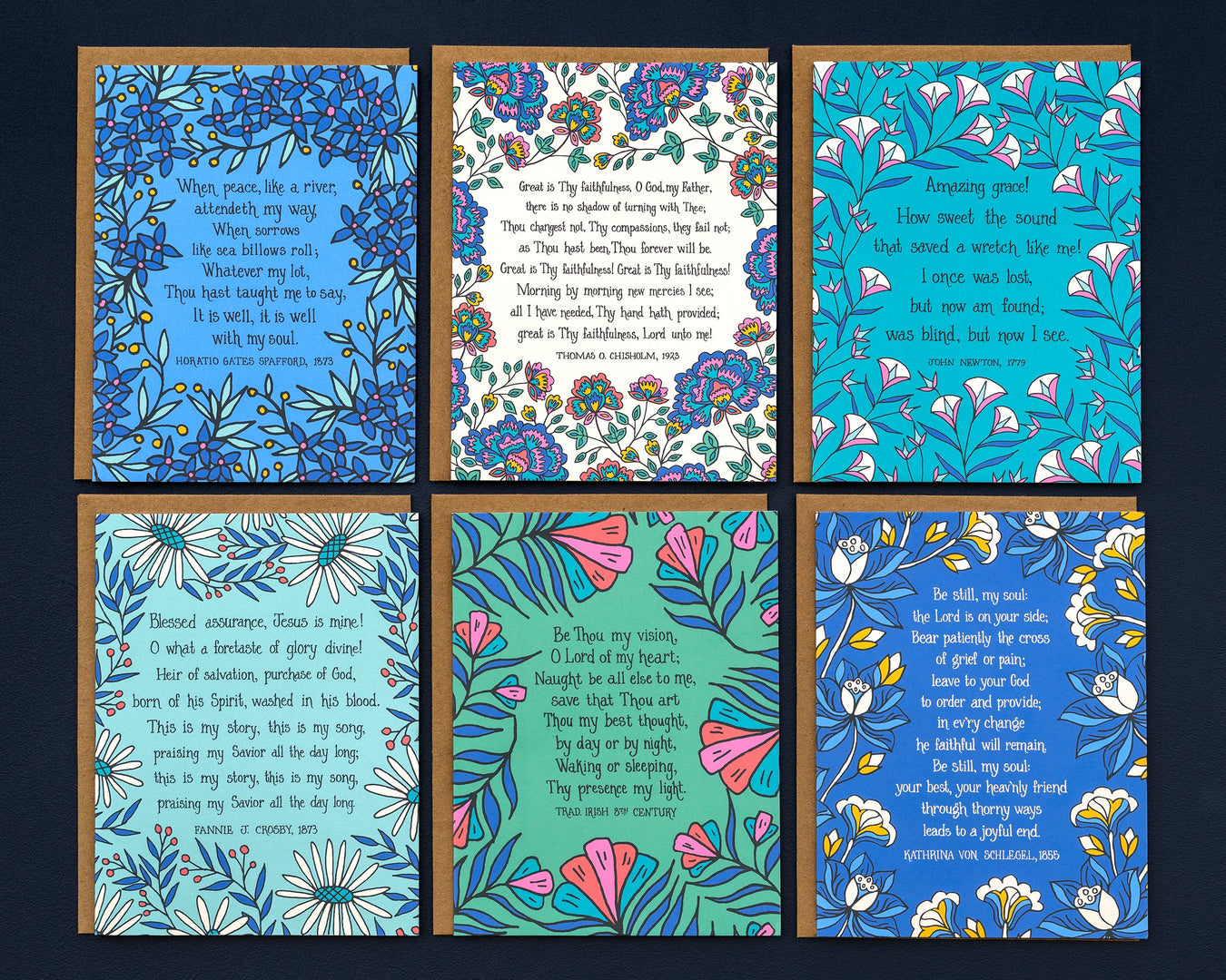 These 8 hymn greeting cards are the perfect way to say "I'm thinking of you" or "I care about you." Each card features a hymn's lyrics on the front and its history on the back. Shown as the set of 8 with kraft paper envelopes against a marble background.