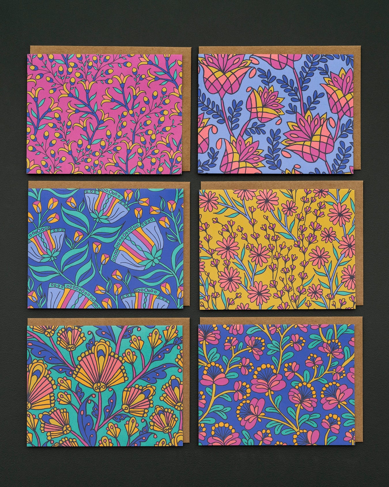 Everyday greeting cards by Little Things Studio are perfect to have on hand to send caring messages to loved ones. Each card features a colorful geometric design and a blank inside. Shown here against a marble backdrop.