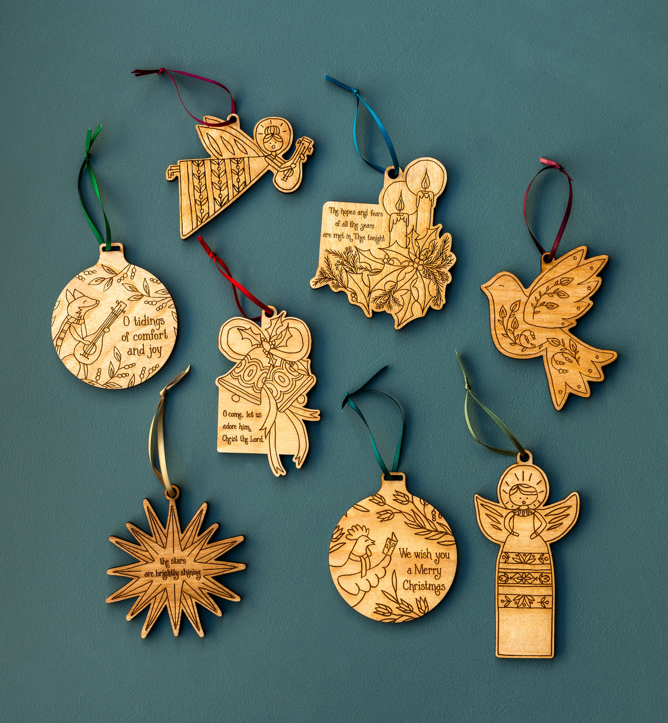 All new Christmas hymn ornaments by Little Things Studio, made from USA maple plywood and laser cut in-house in Nashville and pictured as the set of 8, all tied with a ribbon and ready to hang.