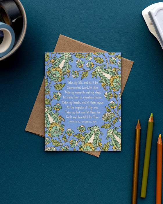 The Take My Life and Let It Be hymn greeting card, framed by saffron and moonstone floral against a stormy blue background, is styled with a kraft paper envelope, colored pencils, and washi tape.