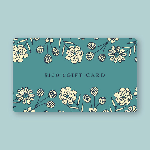 Little Things Studio gift card in the amount of $100—a deep green-blue card featuring custom LTS floral illustrations.