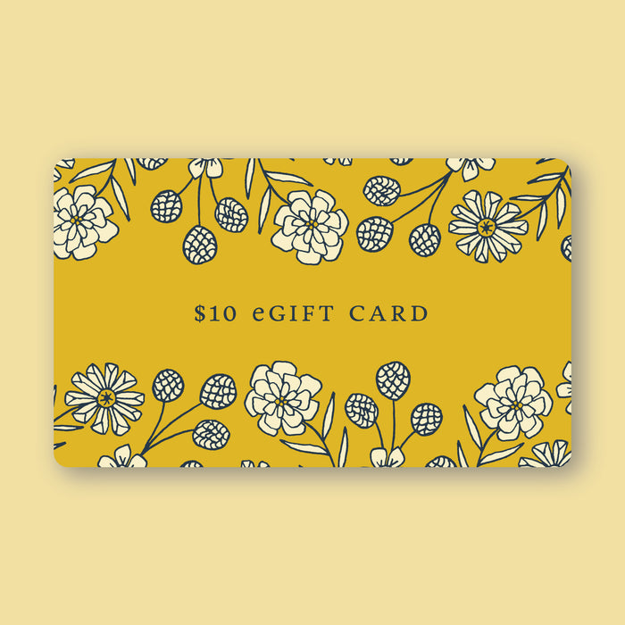 Little Things Studio gift card in the amount of $10—a deep yellow card featuring custom LTS floral illustrations.