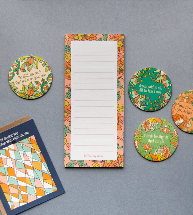 The "Be Thou My Vision" notepad features a hand illustrated floral border, "Be Thou my vision" at the bottom, and a magnet on back, shown hanging on the fridge alongside LTS fridge magnets and the Big Thank You! card.