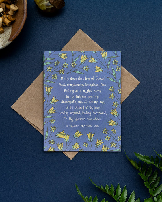 The O the Deep, Deep Love of Jesus hymn greeting card, framed by vintage yellow and dark mint floral against a deep water colored background, is styled with a brown kraft paper envelope, fresh greens, and a ceramic dish of wooden thumb tacks.