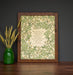 It is Well 11x14 Hymn Wall Art featuring light green floral surrounding the handwritten hymn on a cream background styled in a dark wood frame with a green vase and dried grasses.