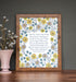 Come Thou Fount hymn wall art 11x14 delicate blue, yellow and pink floral surrounding a handwritten hymn styled with a vase and flowers in a brown wood frame