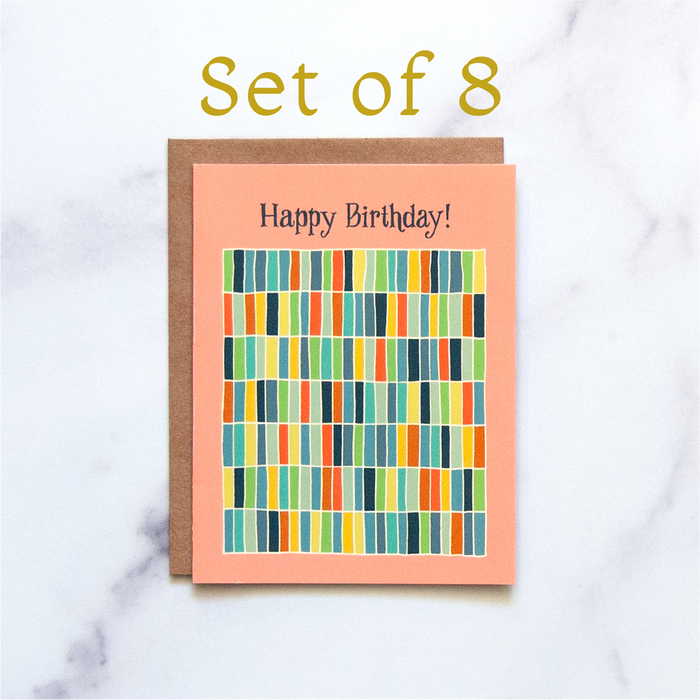 This Happy Birthday! Greeting Card set features hand illustrated, multi-colored geometric design in a rainbow of hues against a happy peach background.