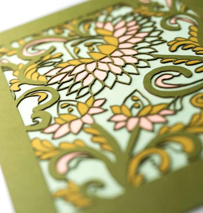 Detail image of the Layered Floral Papercut “Margot” (Spearmint) which is made using cardstock in hues of Jellybean green, salmon, mustard, spearmint.