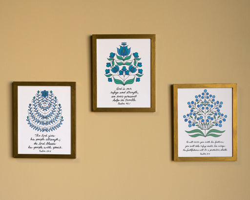 This bundle features three 8 x 10 prints featuring Psalms verses accented by intricate floral illustrations; shown here displayed in wooden frames hung up together