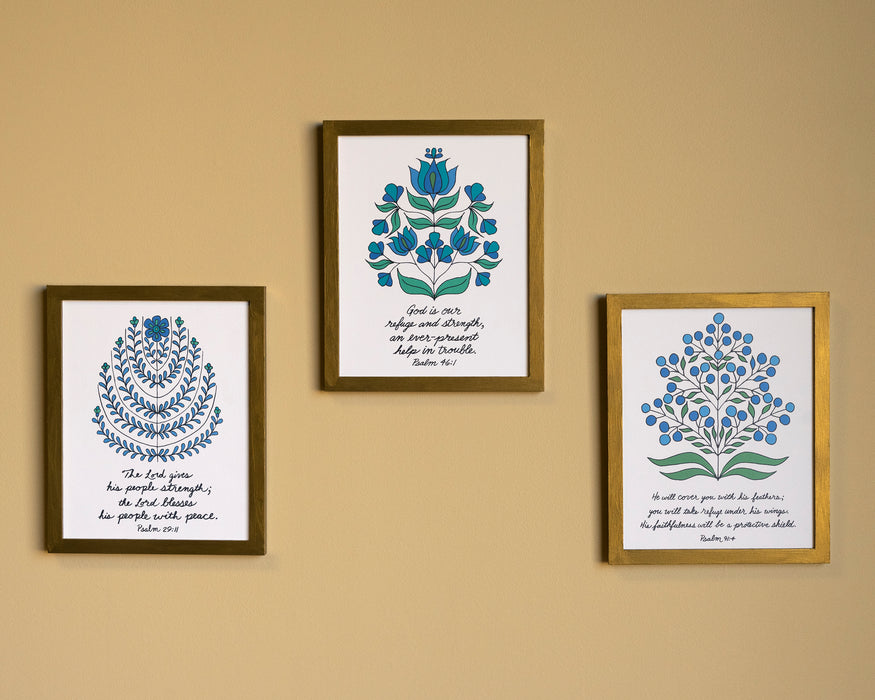 This bundle features three 8 x 10 prints featuring Psalms verses accented by intricate floral illustrations; shown here displayed in wooden frames hung up together