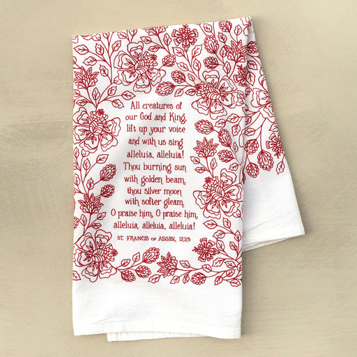 All Creatures of our God and King tea towel is printed in rich crimson, displayed folded against a khaki background