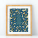 The 8x10 "Be Still, My Soul" hymn art print features hand-lettered hymn text surrounded by a detailed floral on a navy blue background. Shown in a wooden frame against a white background.