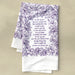 The Be Still, My Soul hymn tea towel featuring the beloved hymn is printed in a deep eggplant purple, shown folded against a khaki background.