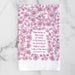 Blest Be the Tie hymn tea towel, printed on a cotton flour sack in midnight magenta, displayed against a white marble backdrop