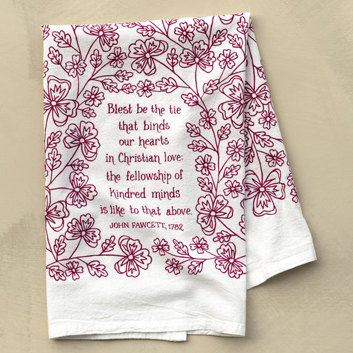 Blest Be the Tie hymn tea towel, printed on a cotton flour sack in midnight magenta, displayed against a khaki backdrop