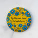 The "By His Own Hand" hymn button features lines from the beloved hymn "He Leadeth Me!" surrounded by striking florals with a mustard yellow background; shown here against a gray background.