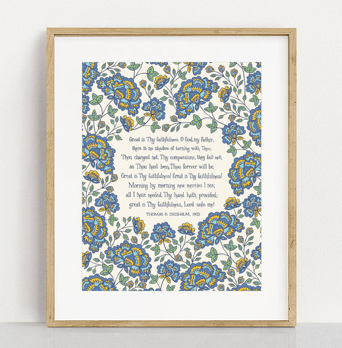 Great Is Thy Faithfulness hymn art print features the cherished hymn, surrounded by a bold blue and gold toned floral against a cream background; shown in a light wood frame against a white background.