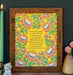 How Firm a Foundation art print — hand-lettered hymn text on a mustard background surrounded by a floral design in orange, pink, and goldenrod against a mango background, pictured in a dark wood frame and styled with a ceramic vase with a flower, candle, and ceramic animal.