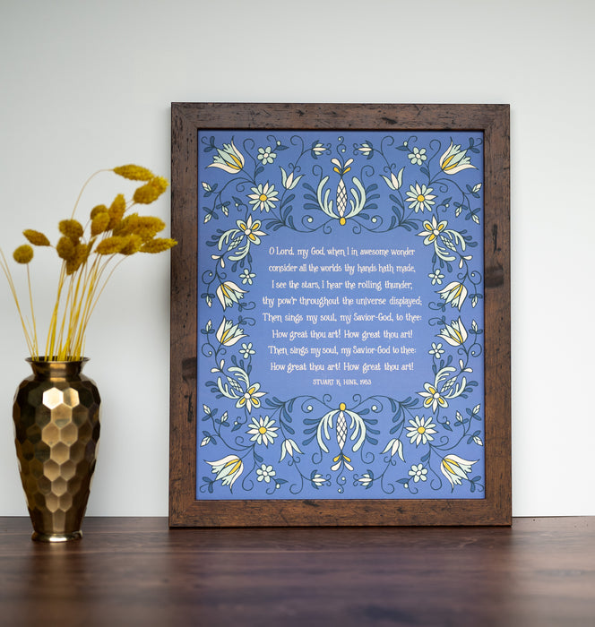 How Great Thou Art hymn wall art — an 11x14 print on a blue background with yellow and green floral styled with a dark wood frame and flowers.