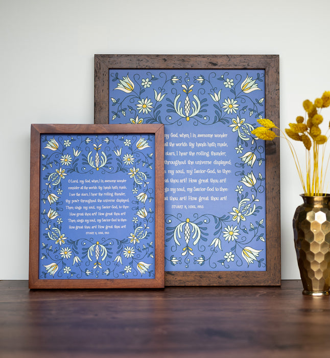 How Great Thou Art hymn wall art — pictured as 8x10 and 11x14 prints on a blue background with yellow and green floral with a dark wood frames and flowers.