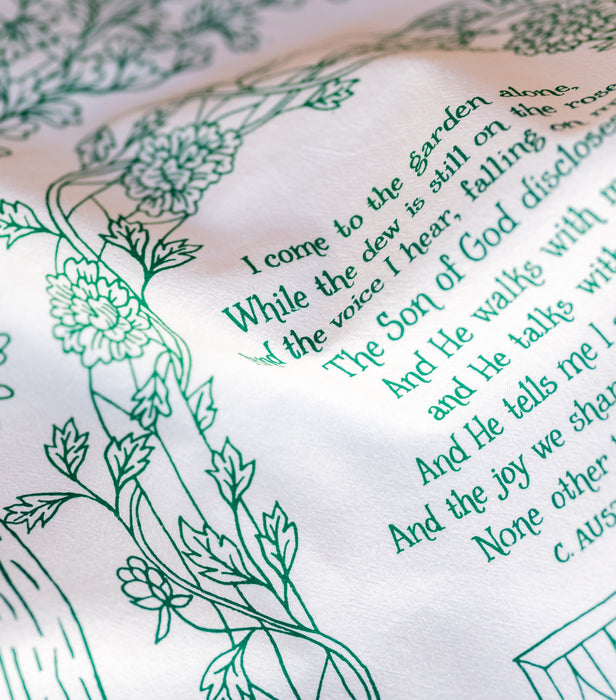 Close-up illustration detail of the gospel song "In The Garden" tea towel, printed in a stunning paradise green—100% cotton and made in the USA.