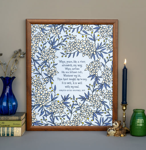 The large format "It Is Well" hymn art print features the much loved hymn text surrounded by delicate floral and a sky blue background,