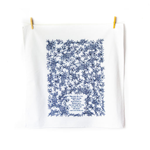 It Is Well With My Soul tea towel is printed in a striking cobalt blue and is shown unfolded and hanging with clothes pins.