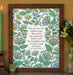 The "It Is Well" hymn art print in 11x14 features hymn text surrounded by a blue and green floral against a vanilla background; shown in a wooden frame and styled with a candle, ceramic owl, and a vase of flowers.