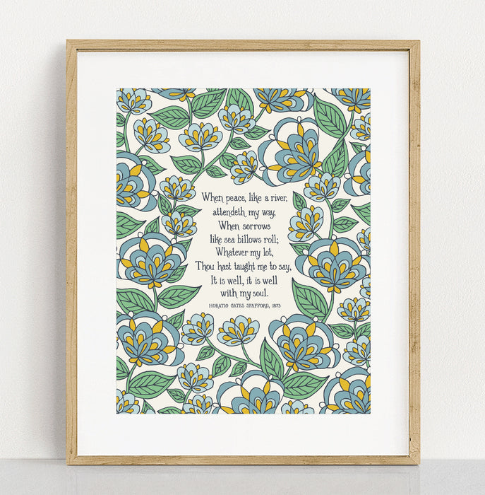 The "It Is Well" hymn art print in 11x14 features hymn text surrounded by a blue and green floral against a vanilla background; shown in a frame against a white background.