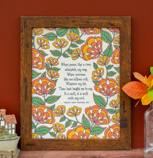 The "It Is Well" hymn art print features hymn text surrounded by a orange florals against a cream background