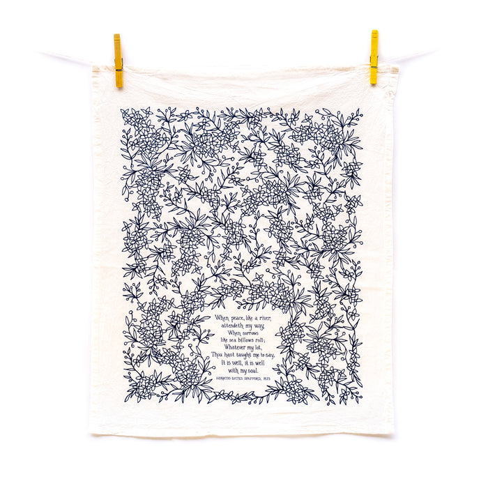 It Is Well With My Soul tea towel is printed in a striking cobalt blue and is shown unfolded and hanging with clothes pins