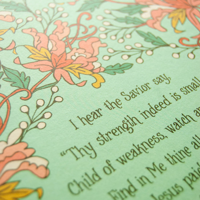 Hand lettered text detail of the Jesus Paid It All art print — a religious wall hanging featuring hand-lettered hymn text printed on a light green background surrounded by floral accents in pink, light red, white, orange and green