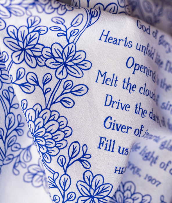 Text detail of Joyful, Joyful We Adore Thee hymn tea towel, which features the beloved hymn is printed in blackberry blue.