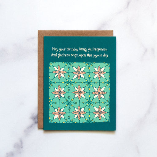 The Birthday Happiness Greeting Card features hand illustrated floral patterns in blue-greens and a splash of pink—a blank birthday card ready for your message