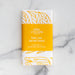 The Power, Love & Self-Control Scripture tea towel is printed in sunflower yellow and features 2 Timothy 1:7, shown folded and wrapped with a matching paper belly band.