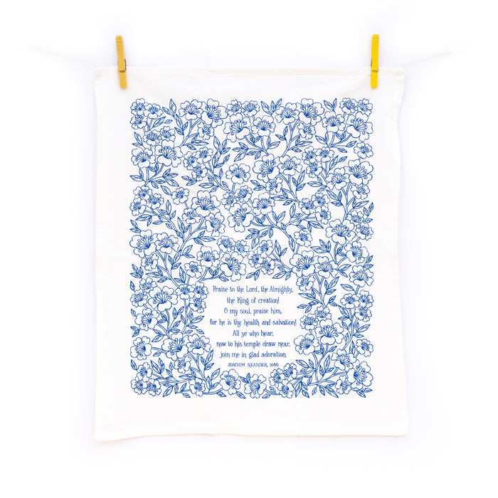 Praise to the Lord the Almighty hymn tea towel is printed in cobalt, displayed at full size, hanging with clothes pins