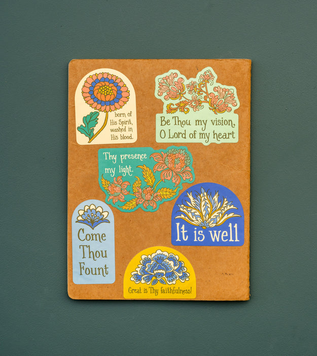 A journal decorated with Little Things Studio stickers