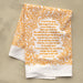 The To God Be the Glory hymn tea towel is printed in pumpkin orange and is shown folded against a khaki background.