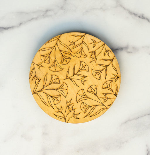 Wooden trivets by Little Things Studio make a lovely housewarming or hostess gift—or a pretty and protective addition to your kitchen. Wood sourced from North Carolina. Shown here against a marble backdrop.