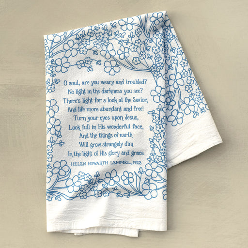 Turn Your Eyes Upon Jesus tea towel in sky blue folded on a khaki background