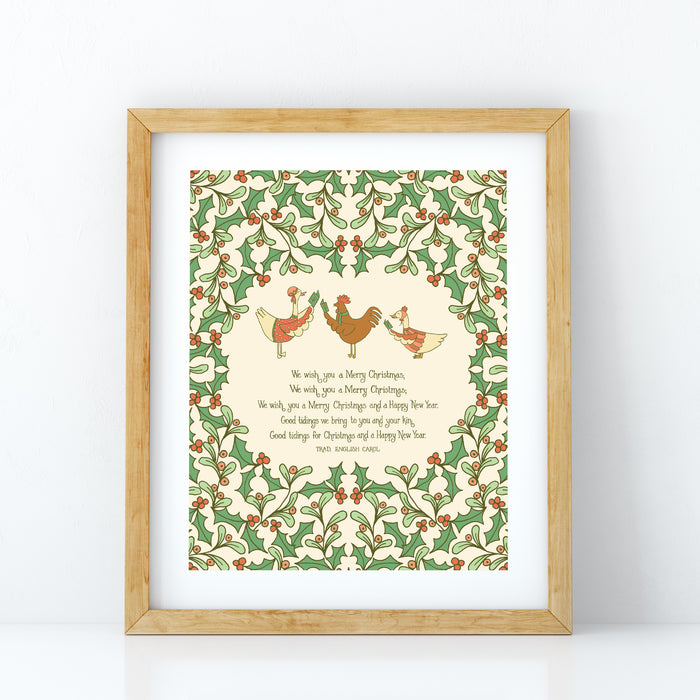 We Wish You a Merry Christmas carol art print features illustration of lovely holly branches with festive animal carolers against a cream background, displayed in a light wood frame