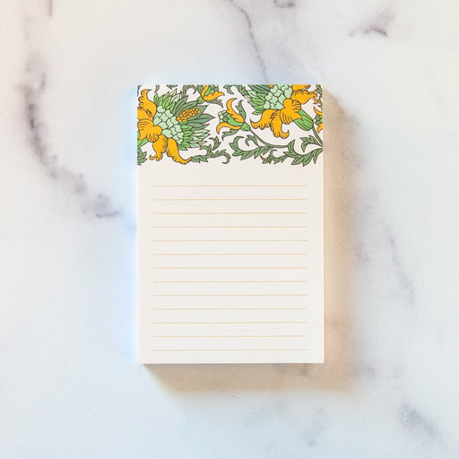 Small notepad with gold floral illustrations and lines