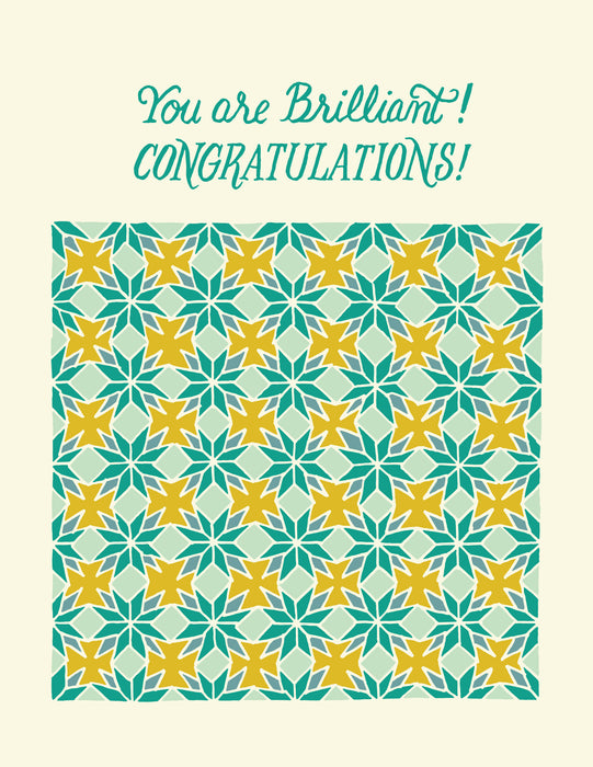 Flat image of the Congratulations greeting card, which features a hand illustrated patterned floral highlighted with blues and yellows on a cream background with a blank inside.