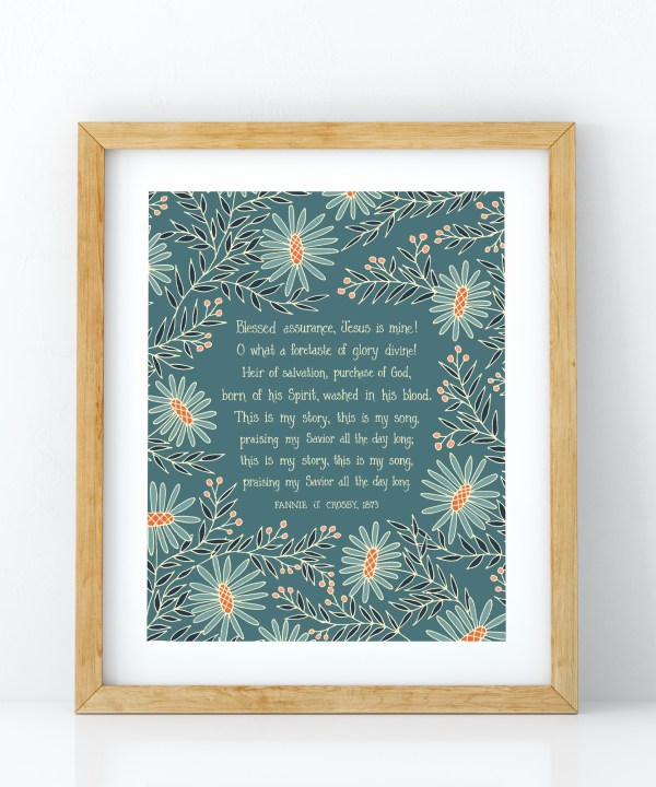 Blessed Assurance wall art — Christian home wall decor featuring hand lettered text on a teal background surrounded by vibrant floral illustrations in blue, navy, cream and mandarin, displayed in a light wood frame