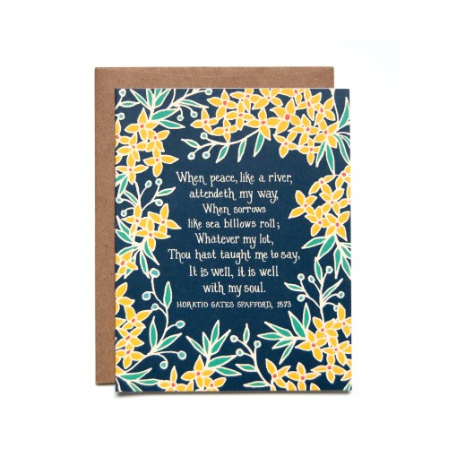 The It is Well with My Soul greeting card features bold yellow floral border surrounding the hymn text against a navy blue background; pictured here against a white backdrop.