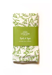 Rock of Ages hymn tea towel—one of our religious kitchen towels— is printed in a fresh grass green and features hand illustrated floral design surrounding the hand-lettered hymn text. Shown folded and wrapped with a printed paper belly band for gift giving.