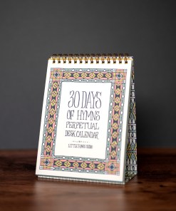 30 days of hymns perpetual calendar on an easel with intricate illustration