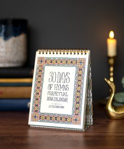 30 days of hymns perpetual calendar on an easel with intricate illustration